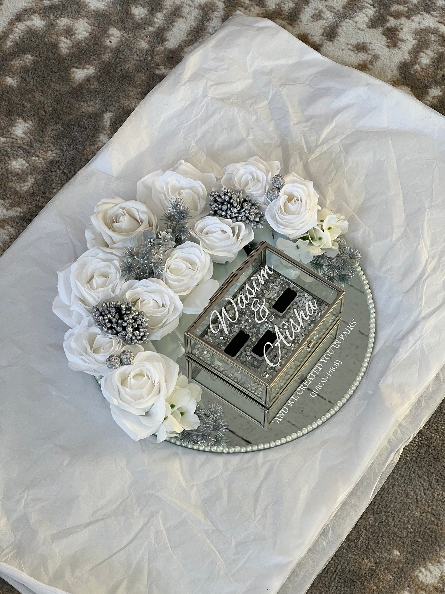 "Round mirror wedding ring plate with floral decor"