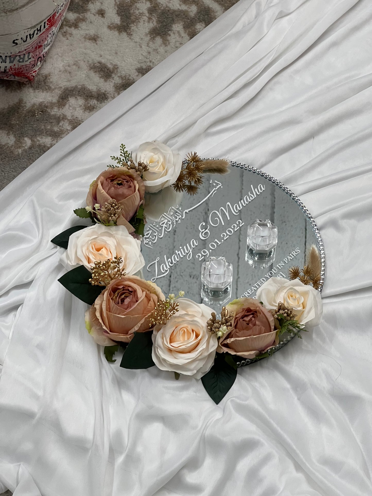 "Round mirror wedding ring plate with floral decor